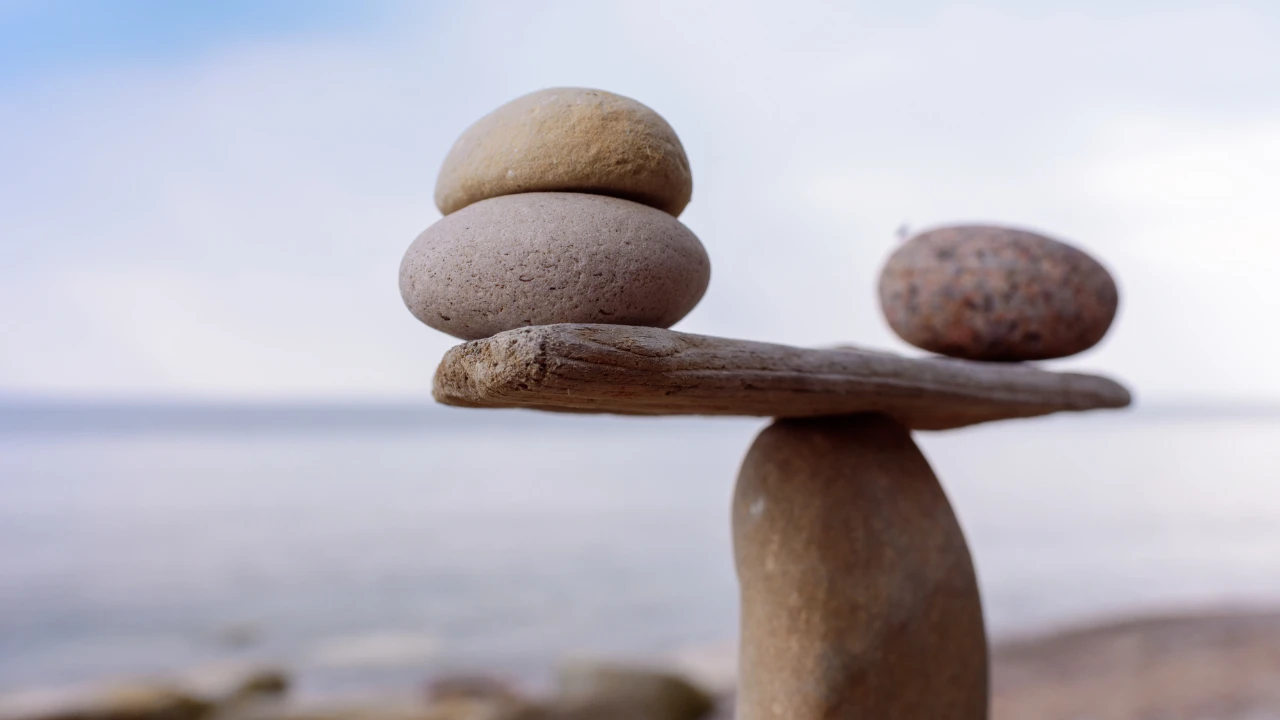 A set of stones arranged as weighing scales.