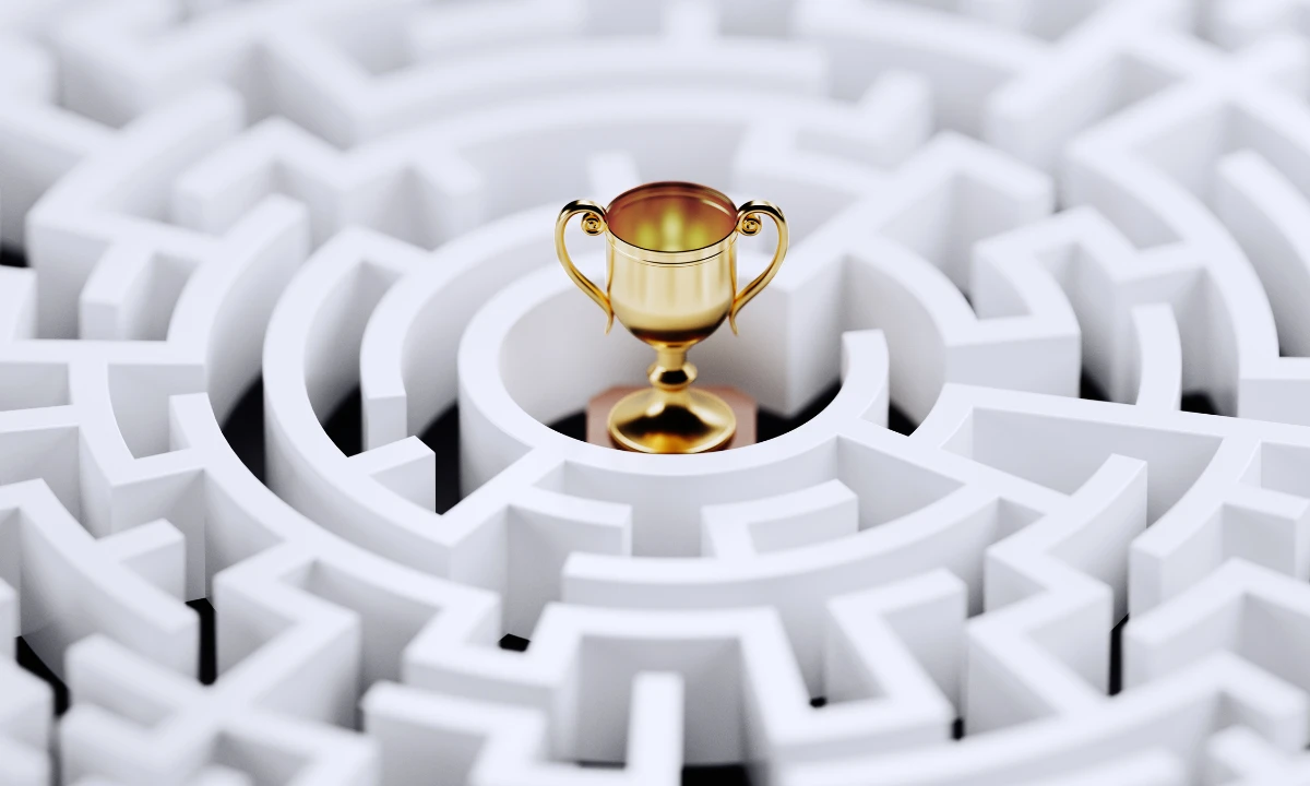 A white maze with a gold trophy in the centre.